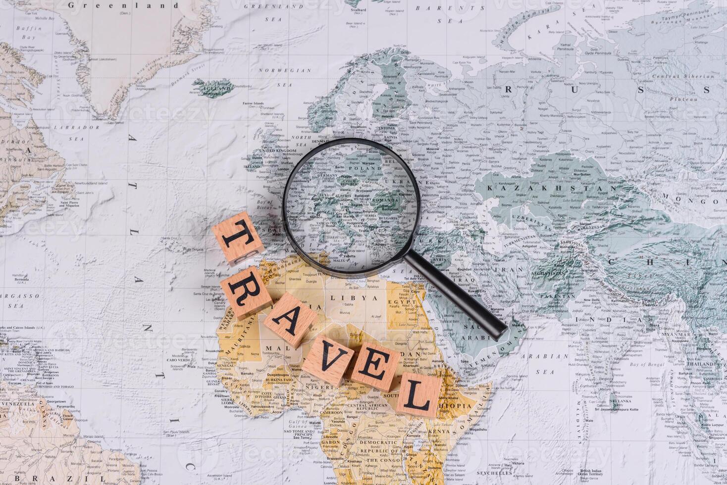 Conceptual background for travel with passport, magnifying glass, world map and money photo