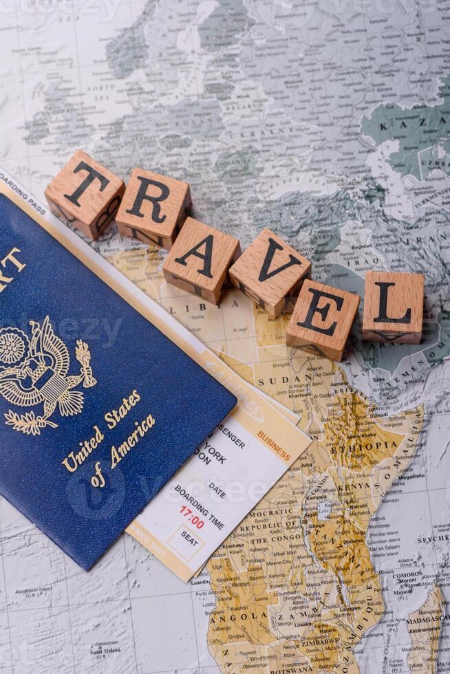 Conceptual background for travel with passport, magnifying glass, world map and money photo