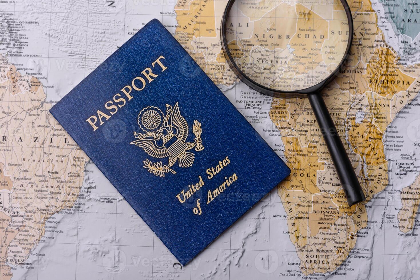 Conceptual background for travel with passport, magnifying glass, world map and money photo
