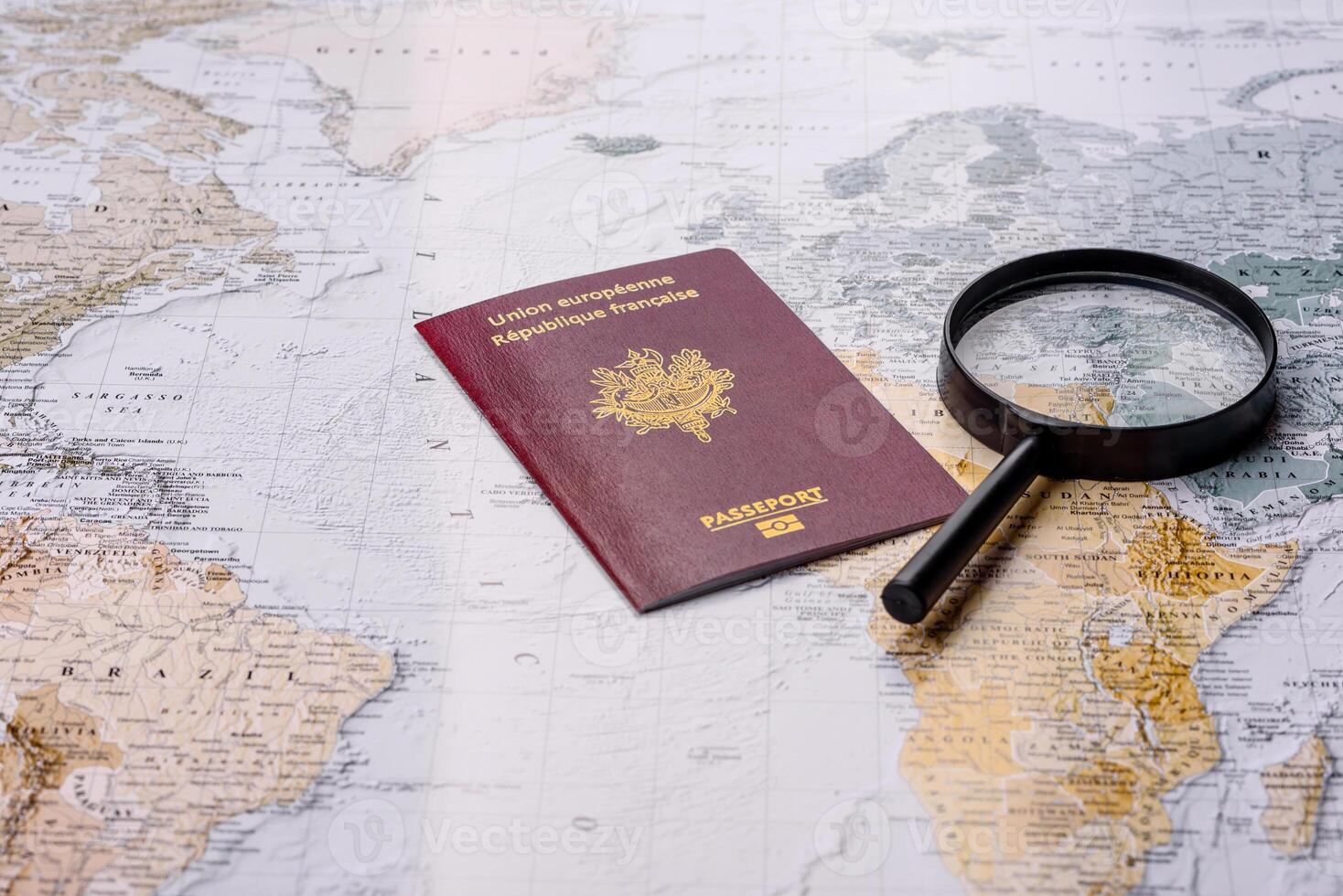 Conceptual background for travel with passport, magnifying glass, world map and money photo