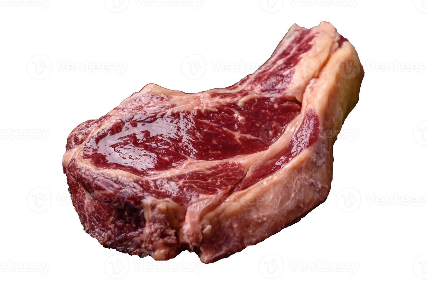 Fresh, raw beef steak with salt, spices and herbs photo