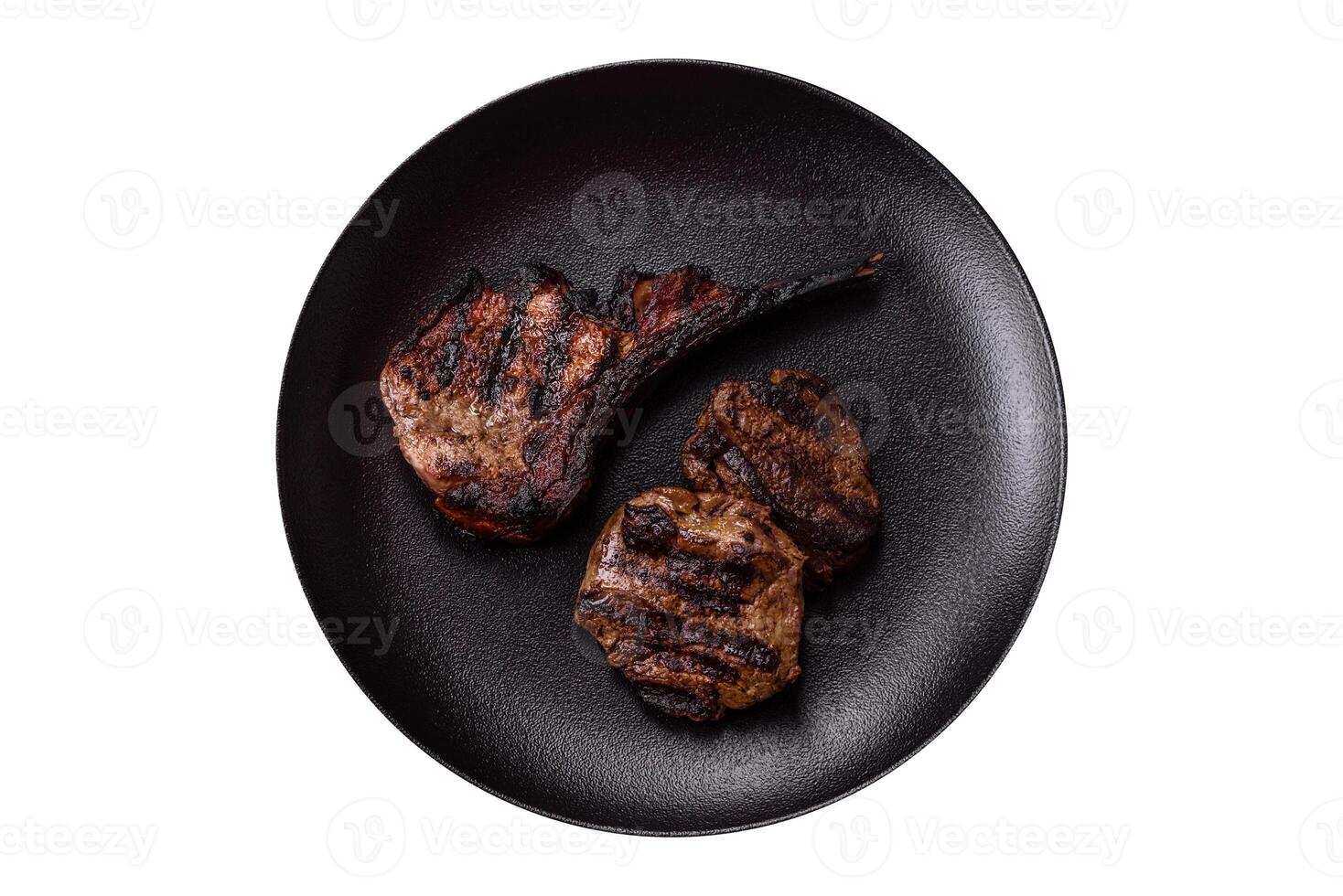 Juicy grilled beef tomahawk steak with salt, spices and herbs photo