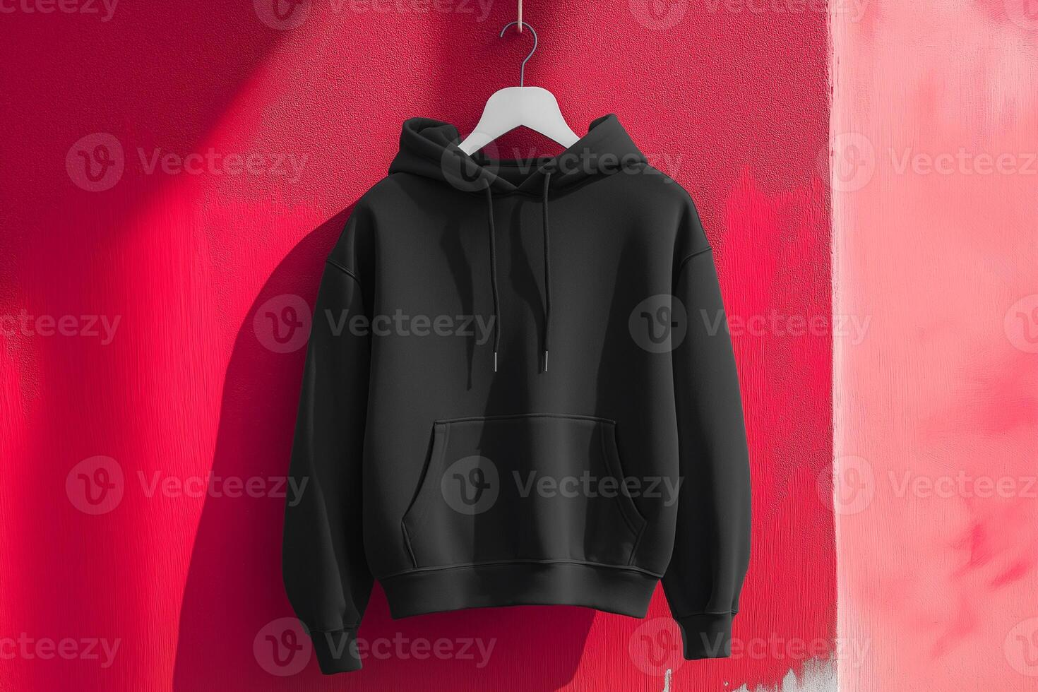Minimal Black hoodie on a red background photo