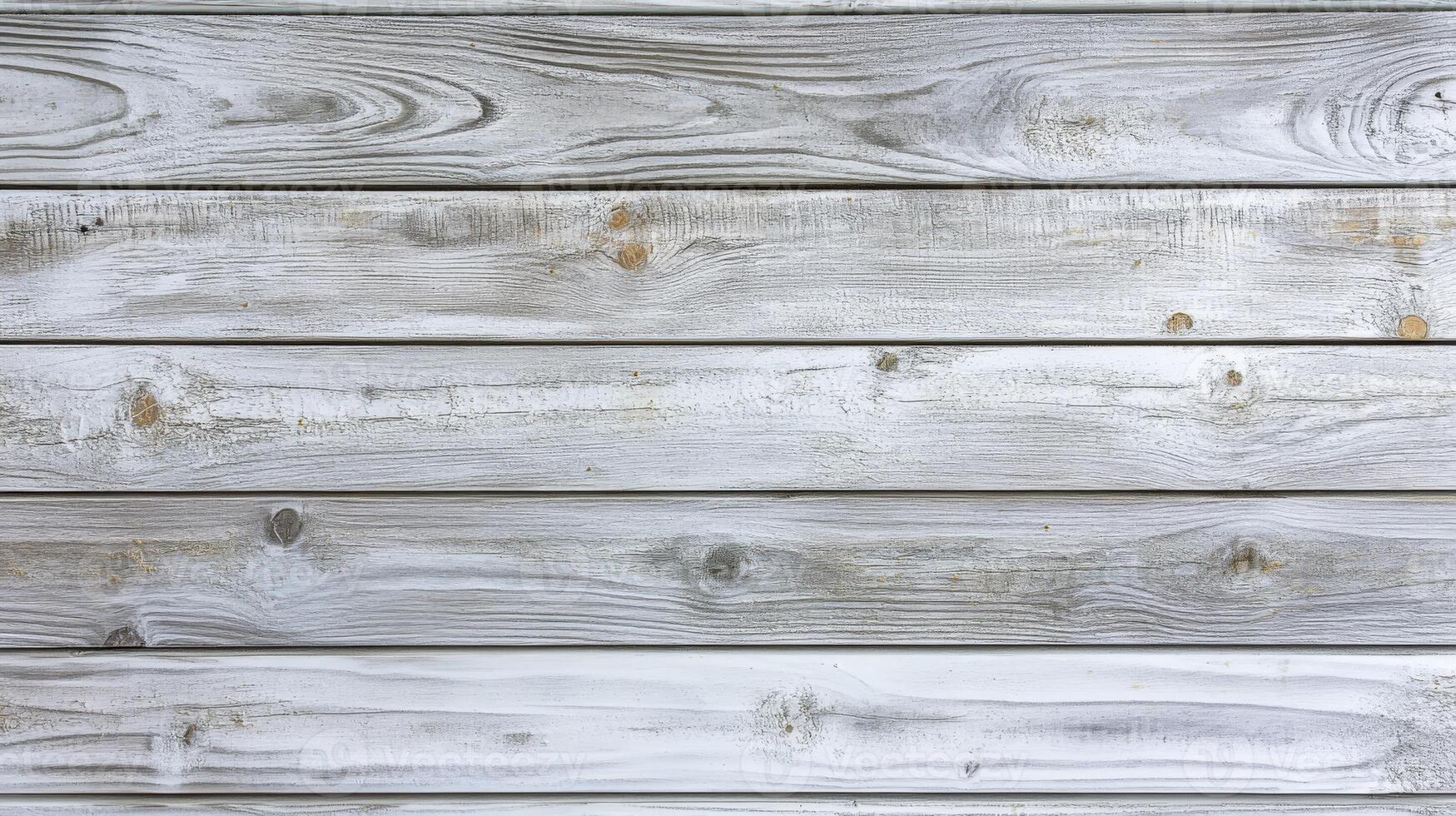 Weathered wood planks with gray tones in rustic setting photo