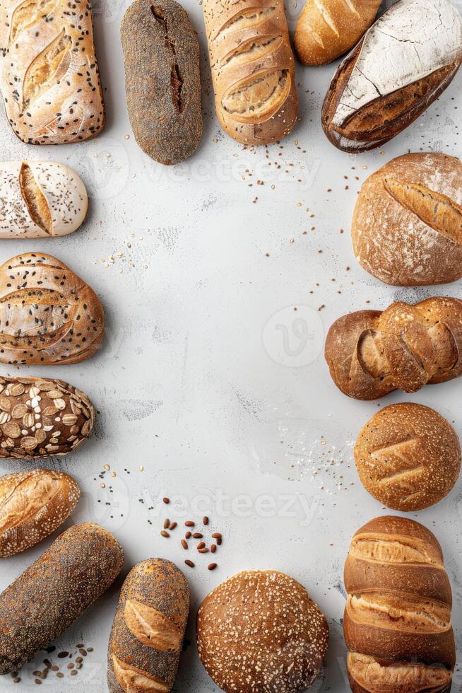 Freshly baked artisanal bread arranged creatively on a neutral backdrop photo