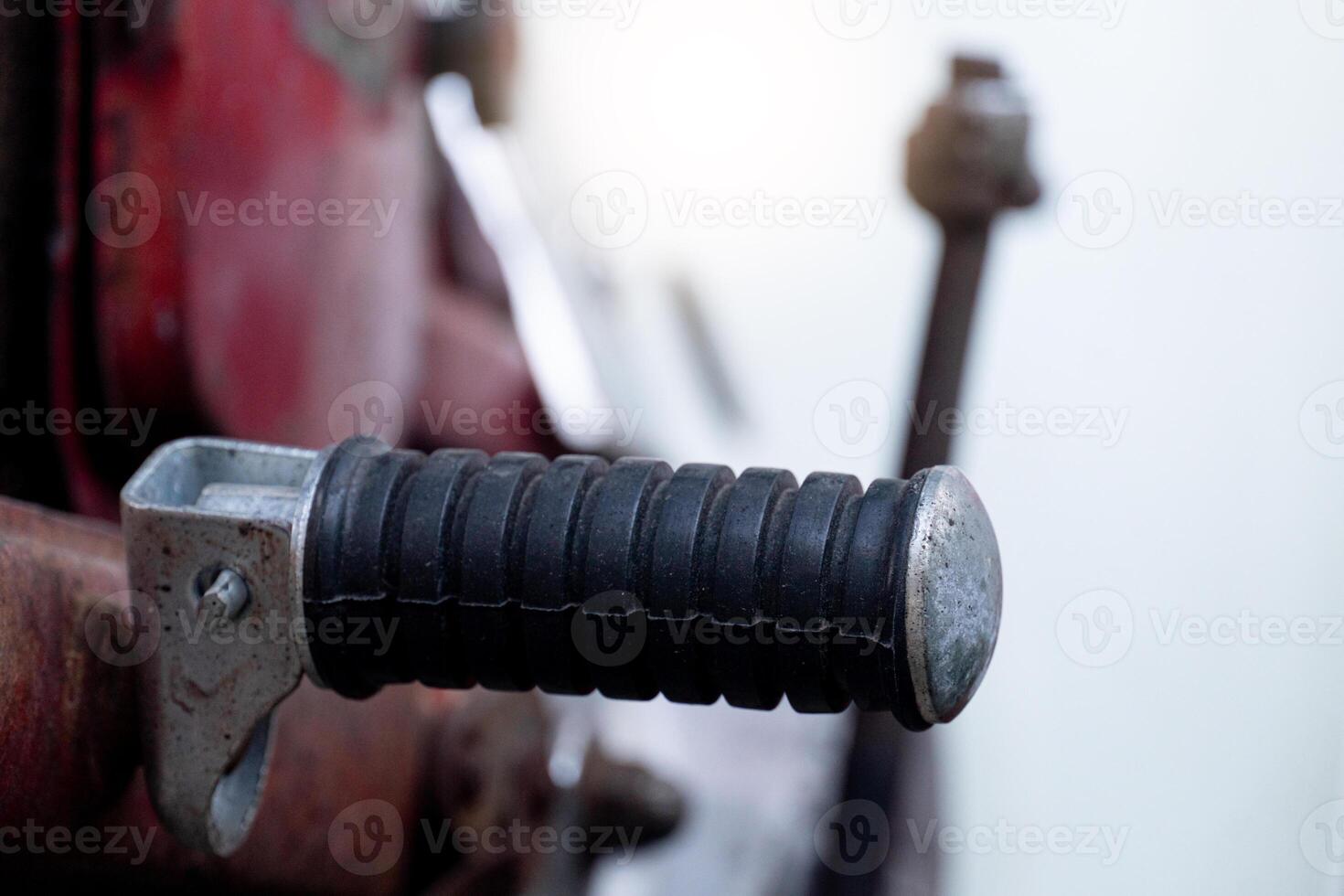 Footrests from old motorcycles. Blurred background of vintage motorcycles. photo