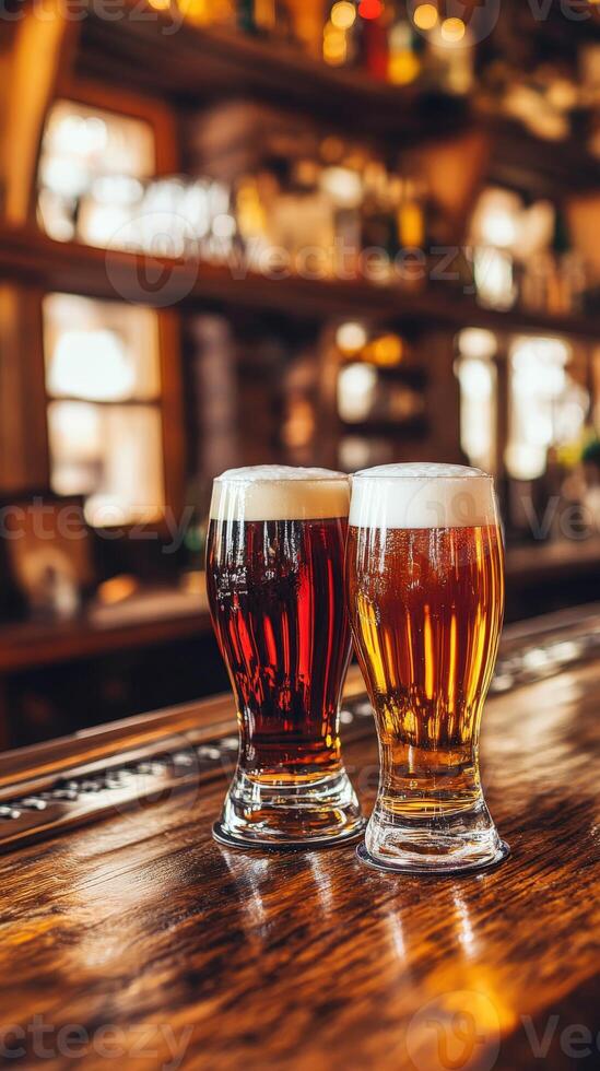 Two glasses of dark and light beer on a wooden bar counter photo