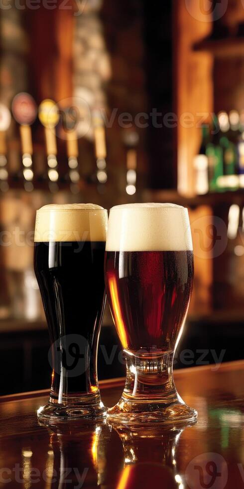 Two glasses of dark and light beer on a wooden bar counter photo