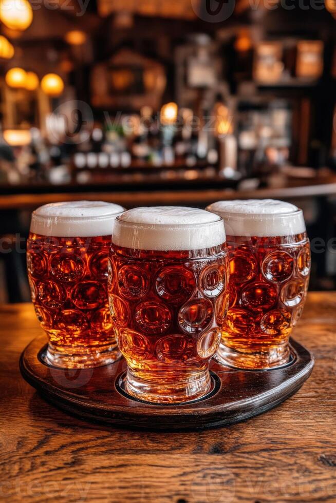 Refreshing beer mugs with foam on a bar table in a cozy pub photo
