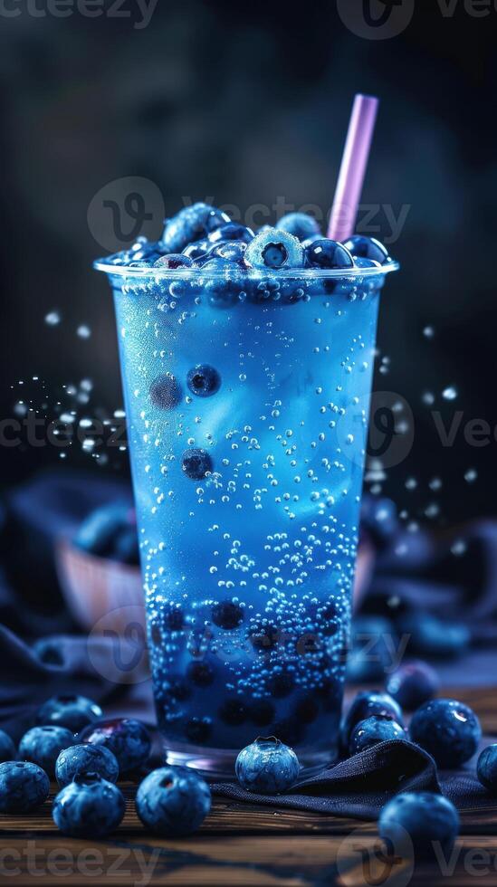 Boba milk tea topped with fresh blueberries in a vibrant setting photo
