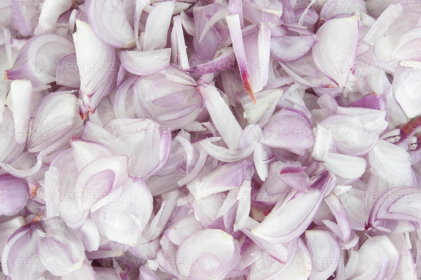 Top view of Sliced peeled shallot in cooking ingredients for background. photo