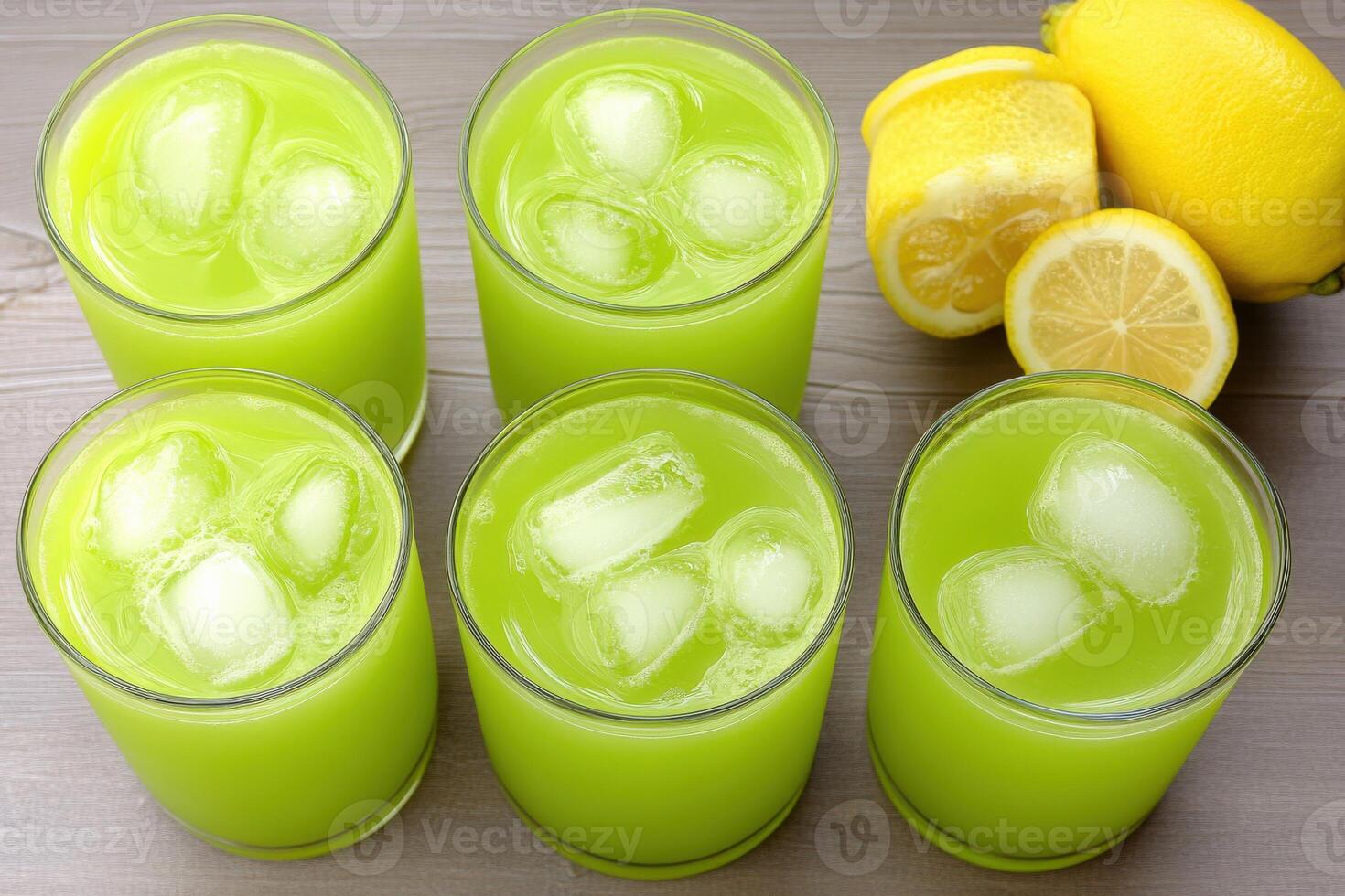 Refreshing green mint lemonade with ice cubes in summer setting photo