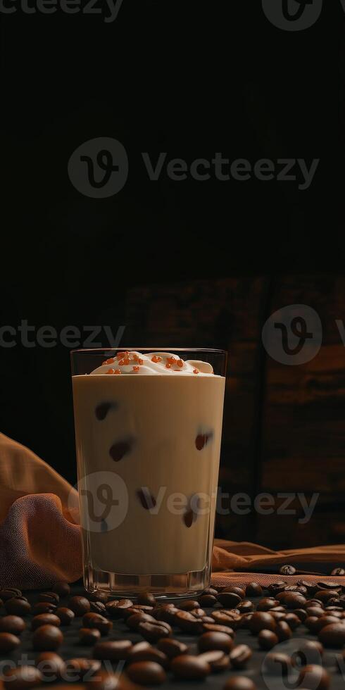 Iced coffee with cream served in a glass on a rustic table photo