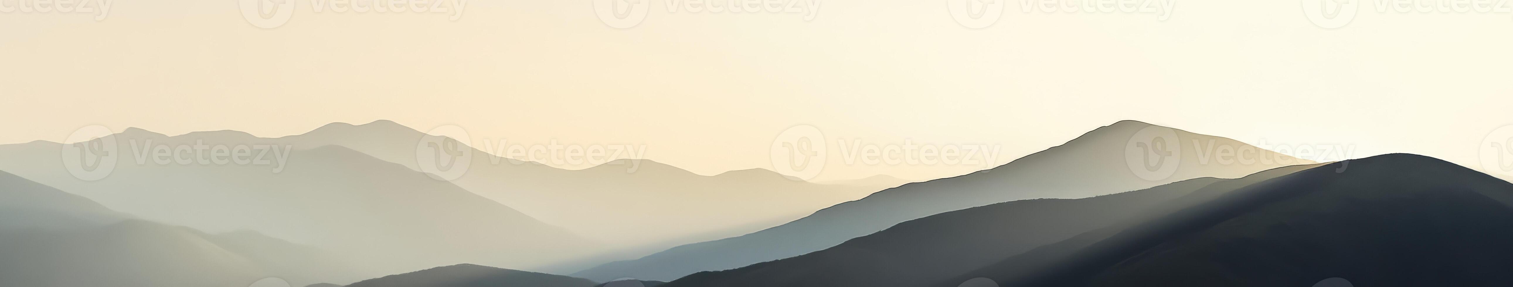 Misty mountains at dusk with fog enveloping the landscape photo