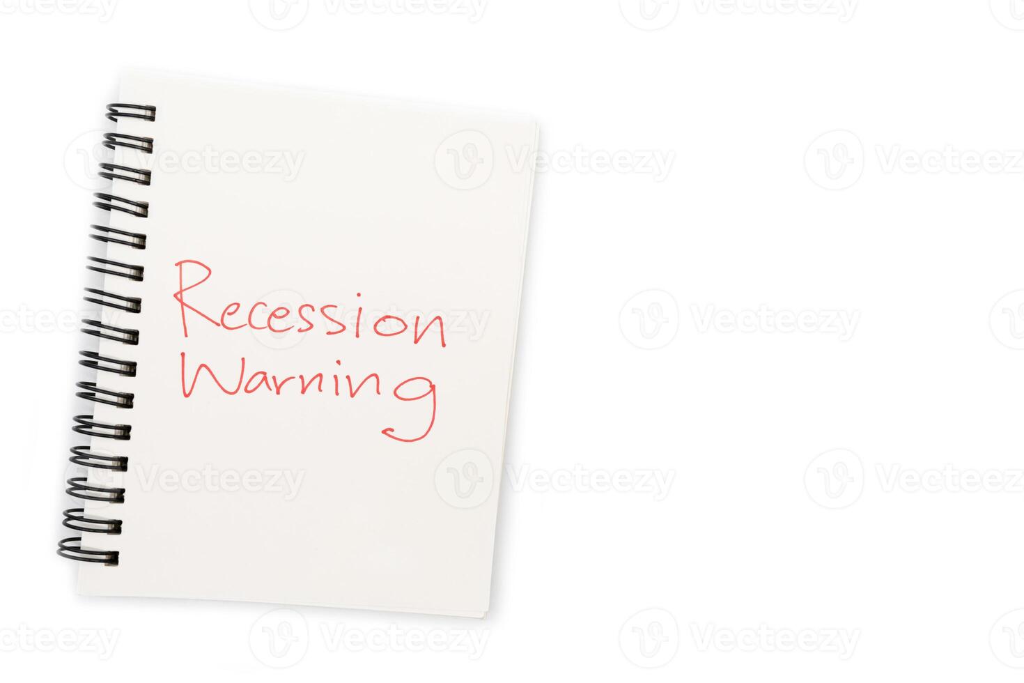 Hand writing Recession Warning on notebook. Global economic crisis. Recession business and stock crisis concept. photo