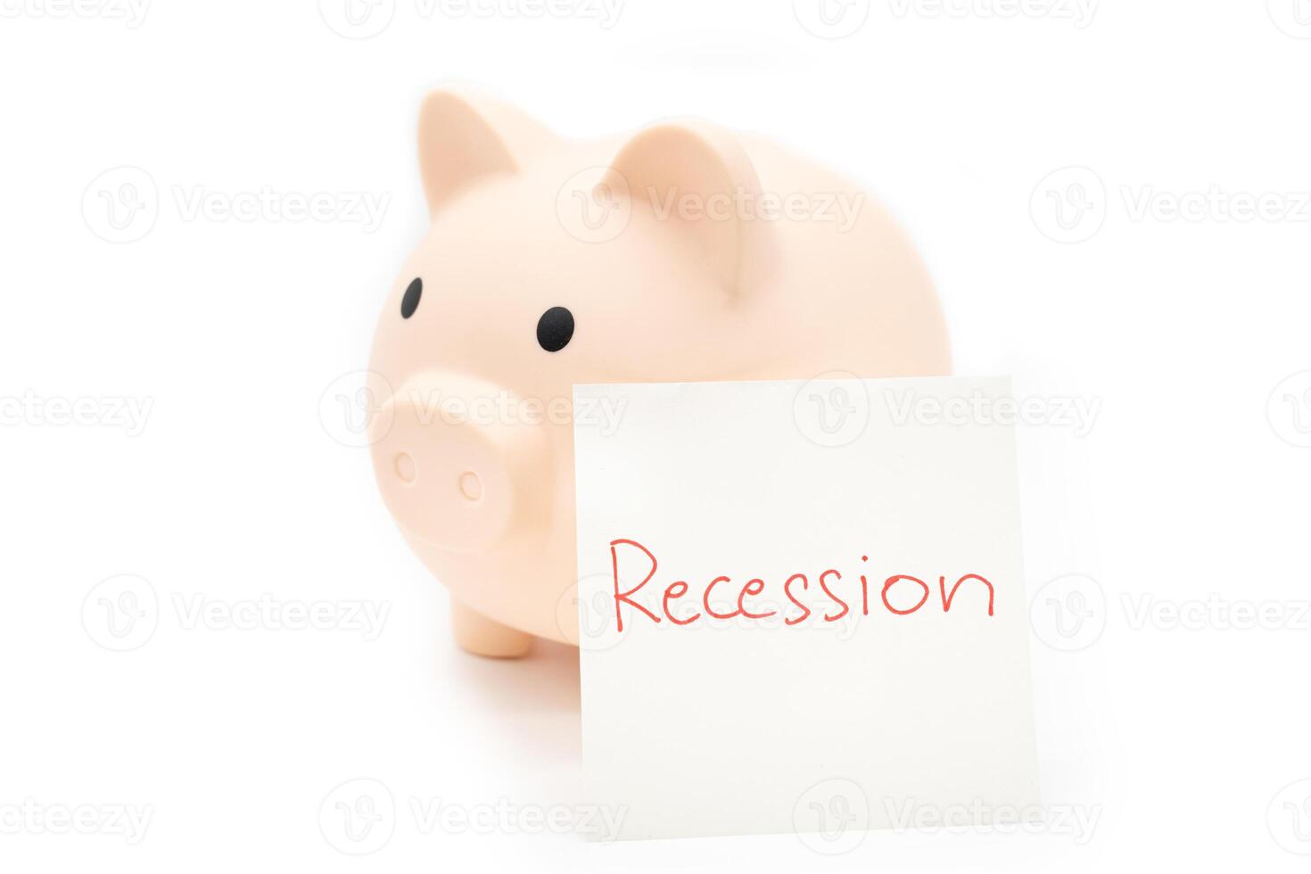 Hand writing Recession Warning on paper note with piggy bank. Global economic crisis. Recession business and stock crisis concept. photo