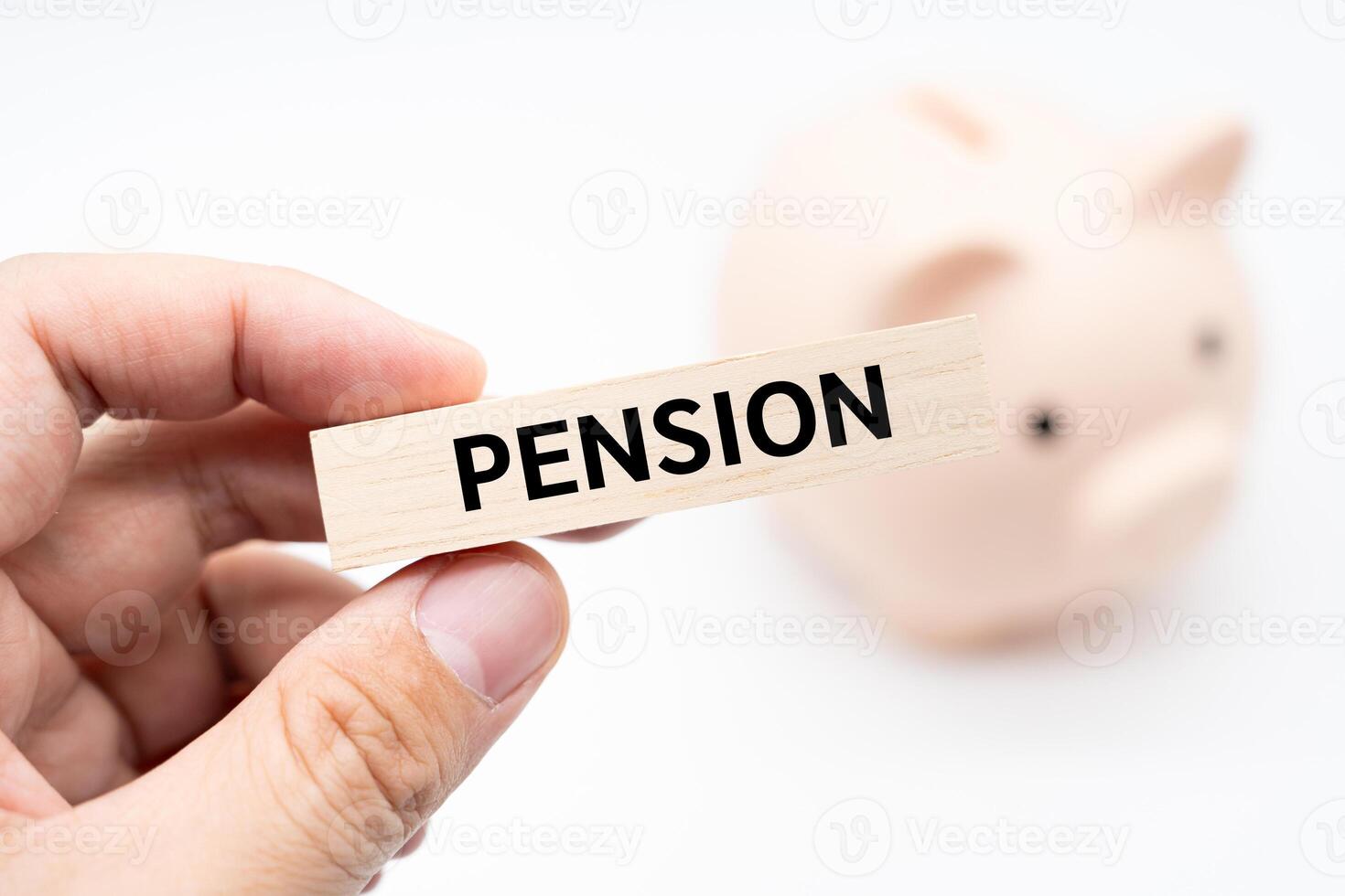 Text PENSION on wooden block with piggy bank on the background. Financial and business concept. retirement saving concept. photo