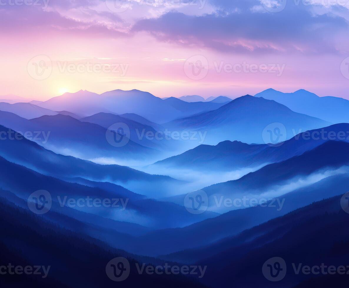 Foggy mountains at dusk with vibrant colors in the evening sky photo