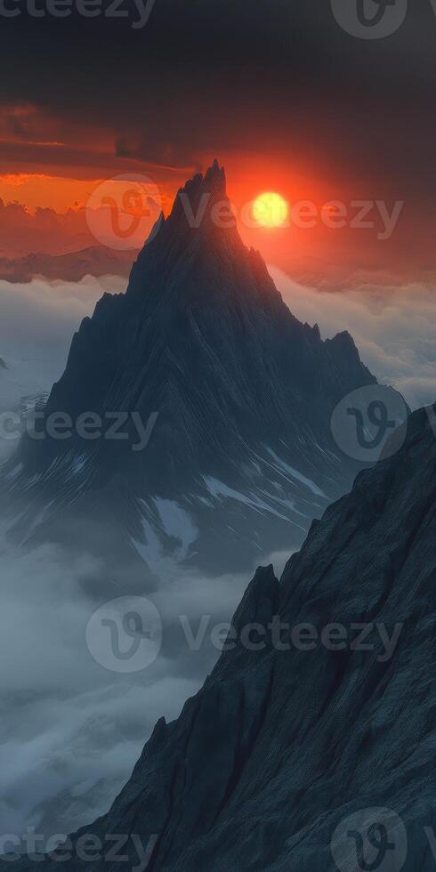 Evening fog envelops majestic mountains under a glowing sunset photo