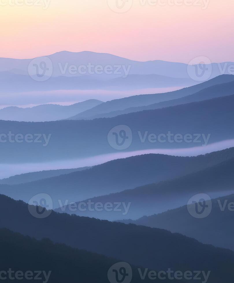 Evening fog envelops rolling mountains at twilight photo