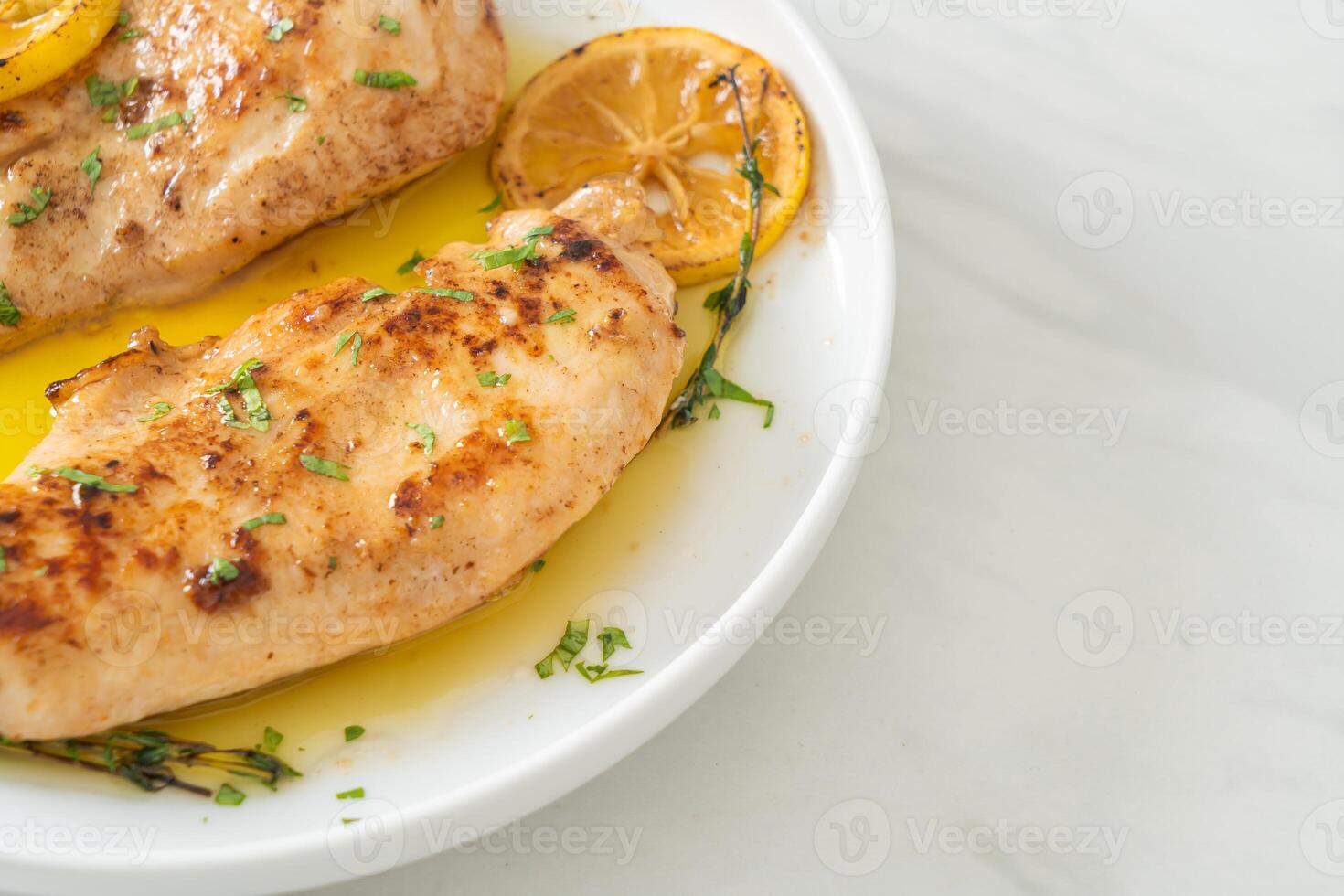 grilled chicken with butter, lemon and garlic photo