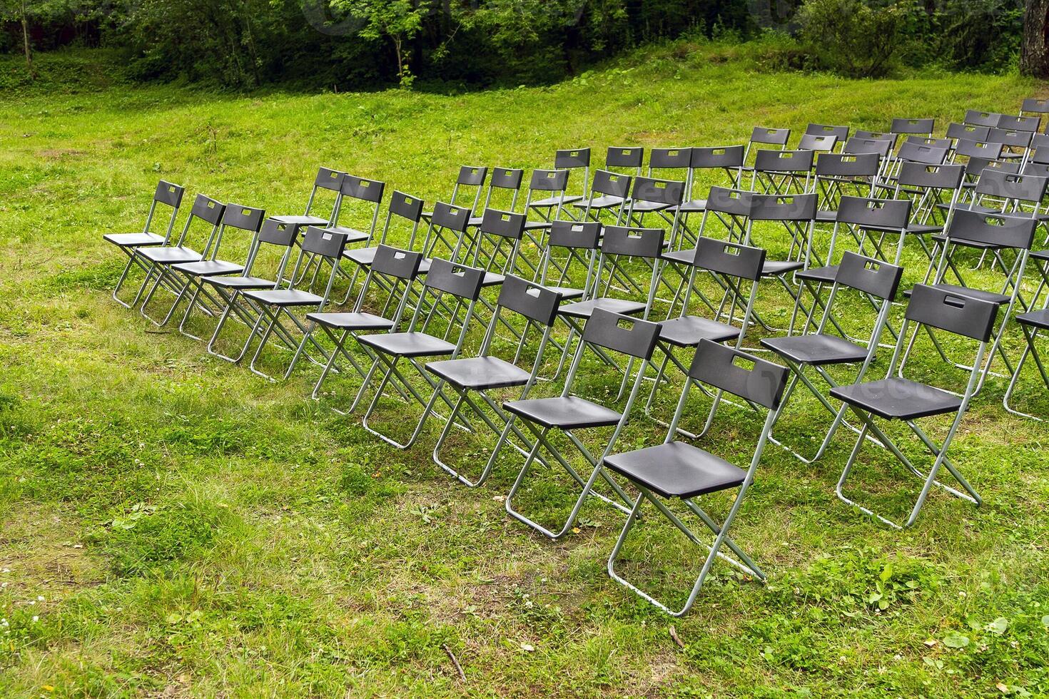 Wedding Chairs in a Row on the Green Grass photo