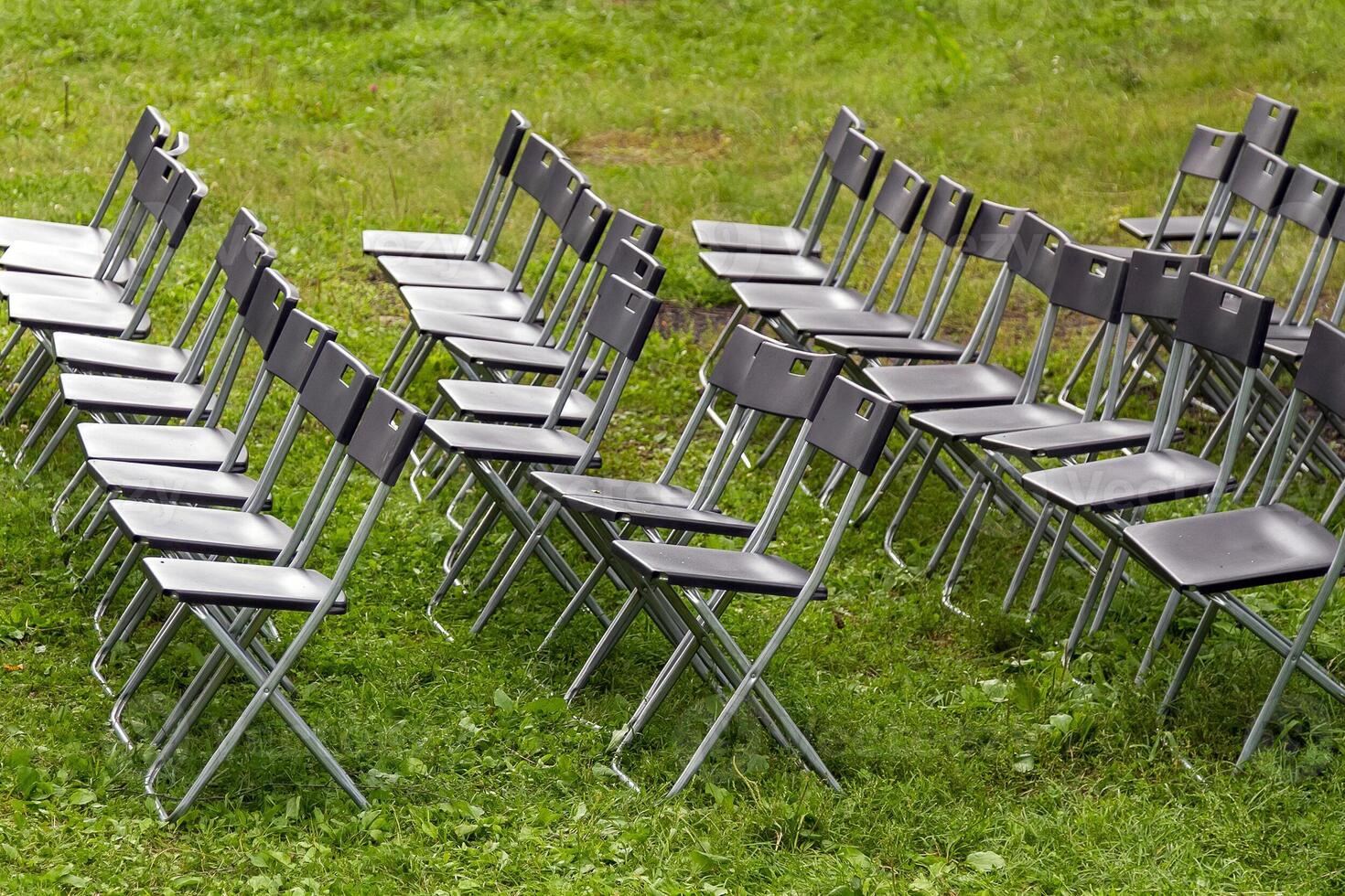 Wedding Chairs in a Row on the Green Grass. photo