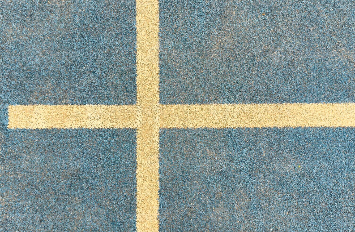 white line on a blue paddle tennis court. photo