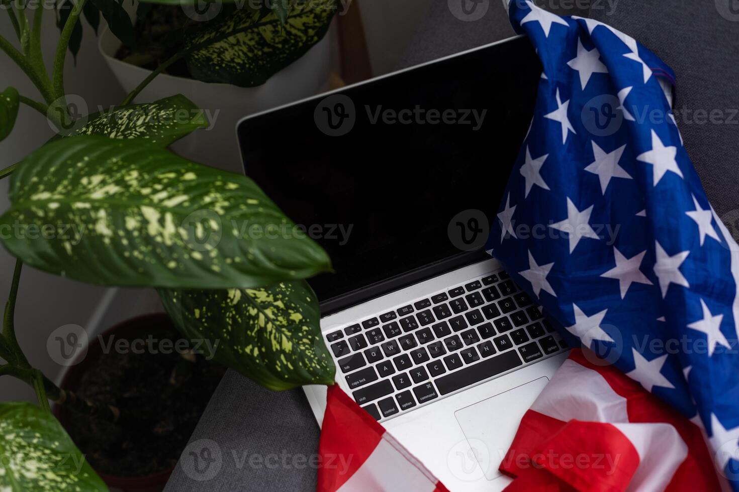 Internet and network security. Computer with binary computer code and American flag photo