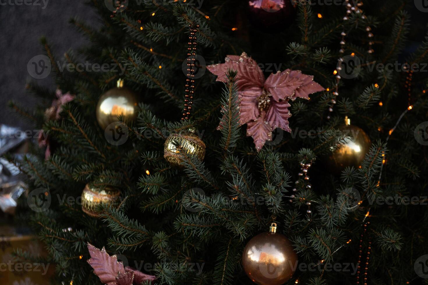 Christmas background. Beautiful colorful decorations on the Christmas tree with lights. Abstract concept for holidays and winter time. photo