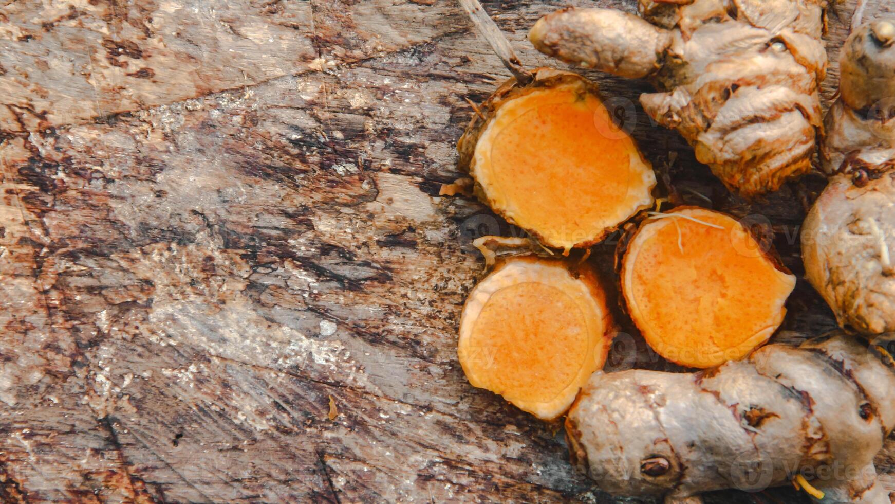 Turmeric or Curcuma longa Linn or rhizome root, a tuber plant that has a distinctive color and aroma photo