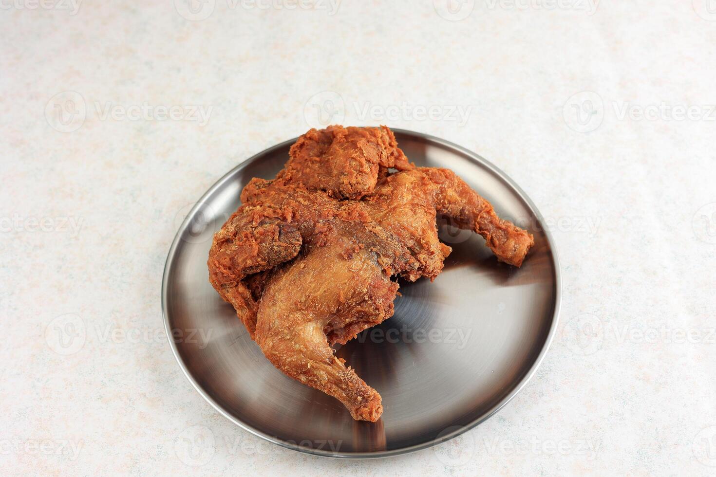 Whole Chicken Fried and Crispy on Silver Korean Plate. photo