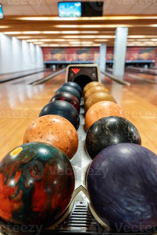 Bowling is a target sport and recreational activity in which a player rolls a ball toward pins photo