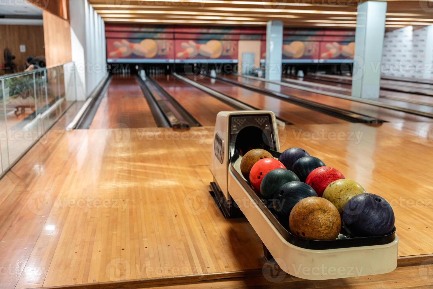 Bowling is a target sport and recreational activity in which a player rolls a ball toward pins photo