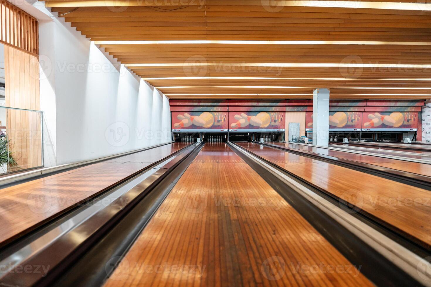 Bowling is a target sport and recreational activity in which a player rolls a ball toward pins photo