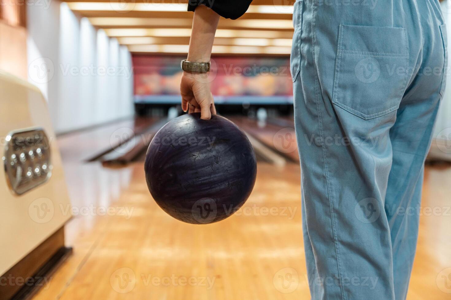 Bowling is a target sport and recreational activity in which a player rolls a ball toward pins photo