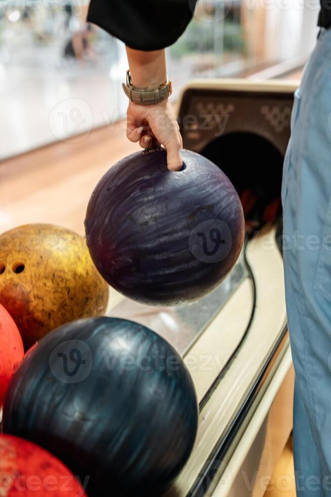 Bowling is a target sport and recreational activity in which a player rolls a ball toward pins photo