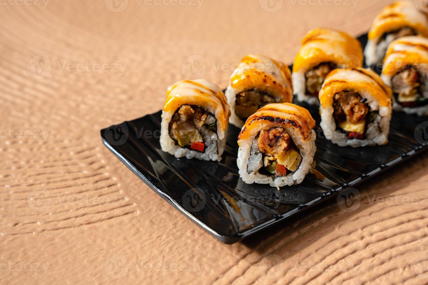 sushi is a Japanese dish of prepared vinegared rice, usually with some sugar and salt, accompanied by a variety of ingredients such as seafood, often raw and vegetables. photo