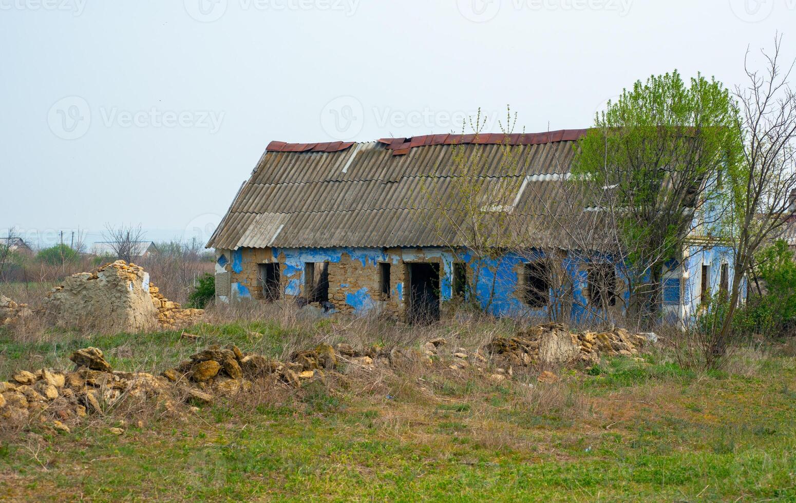 Abandoned old empty rural house that collapses from time to time, Ukraine photo