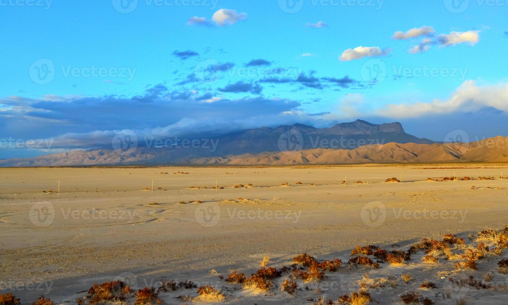 Desert at sunset and thunderclouds against the backdrop of the Guadalupe Mountains in New Mexico photo