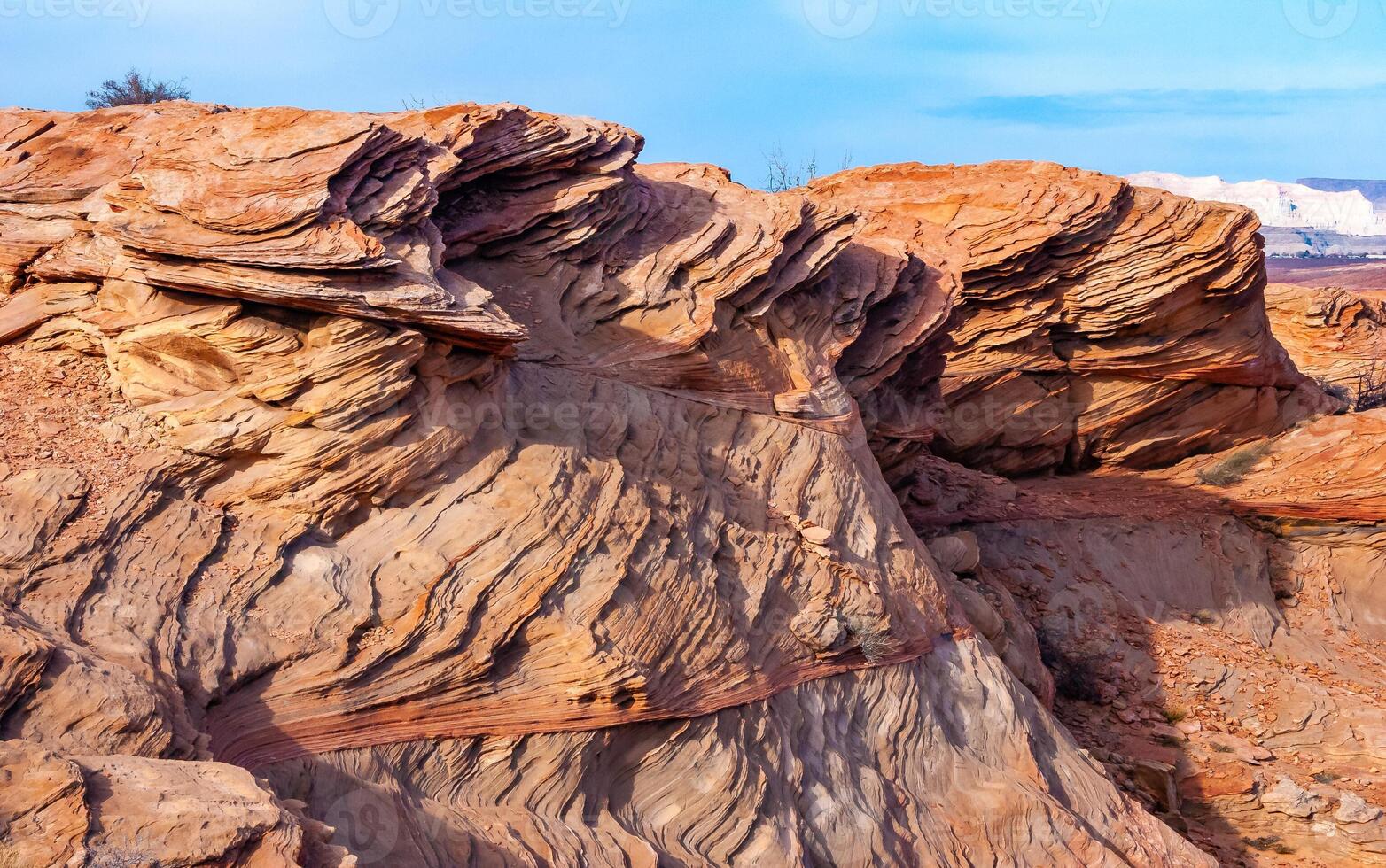 Layered weathered red sandstone rock formations photo