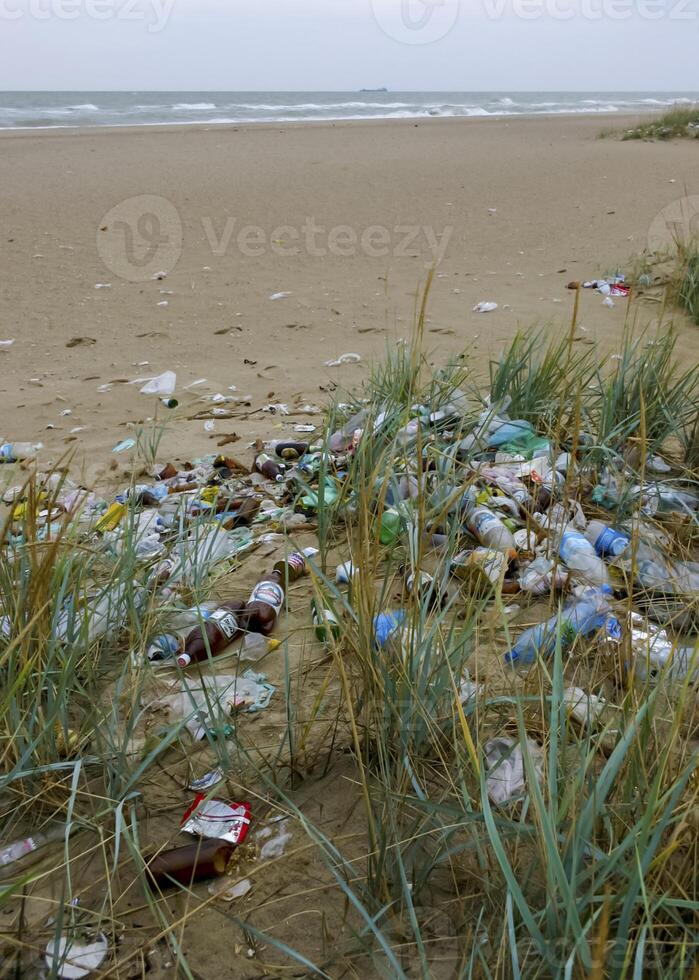 Ecological problem, pollution of nature with plastic waste. Sea coast pollution photo