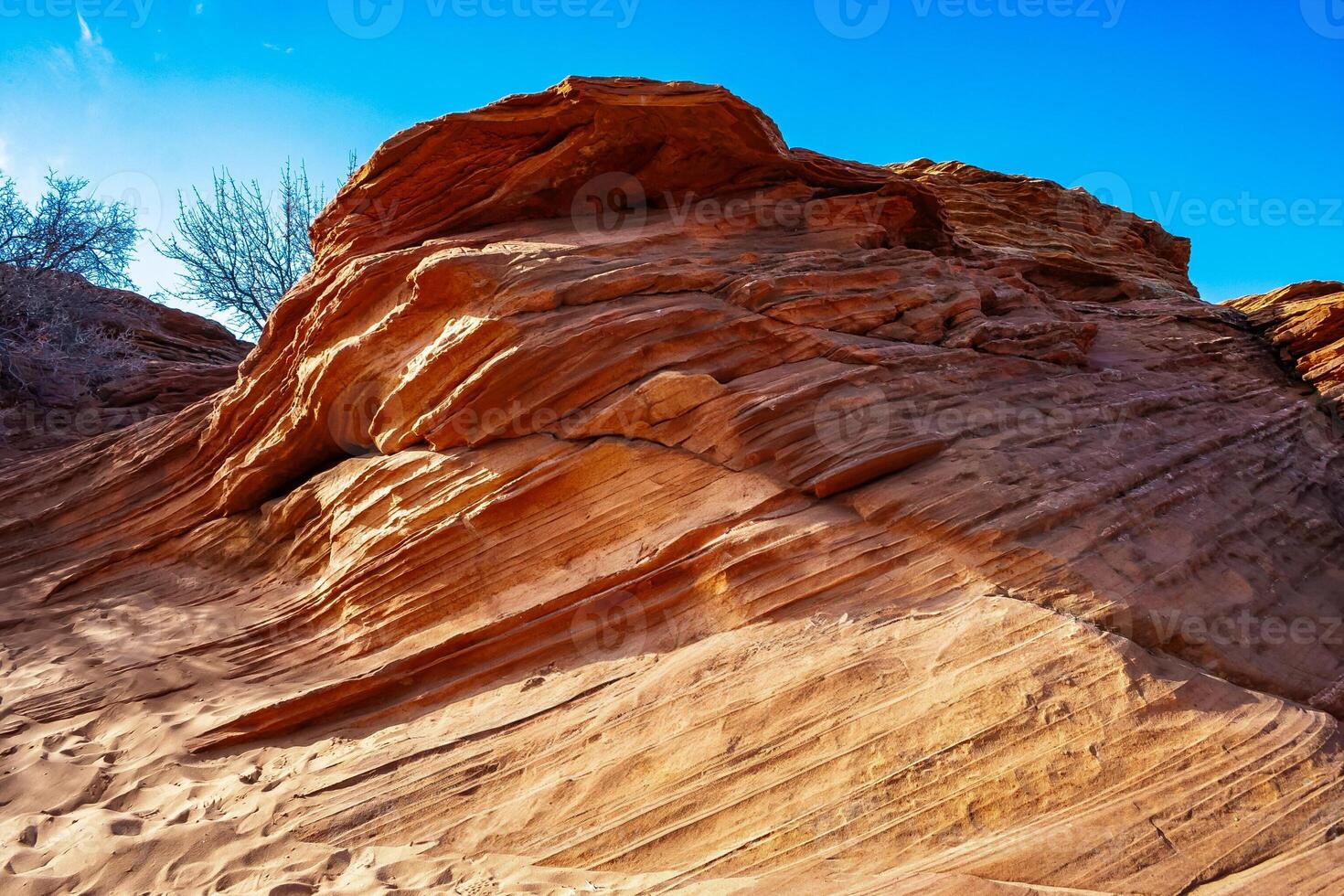 Layered weathered red sandstone rock formations photo