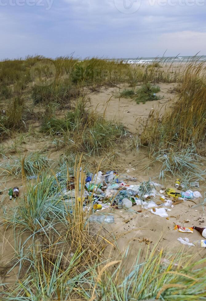 Ecological problem, pollution of nature with plastic waste. Sea coast pollution photo
