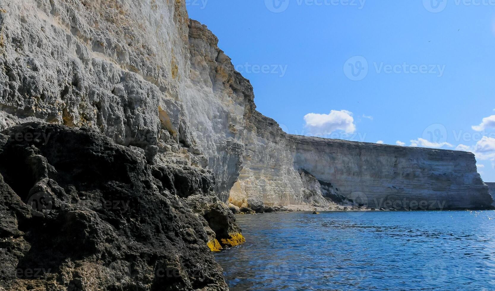 High Coastal cliffs from layered Pontic limestone in the western Crimea, Tarkhankut photo
