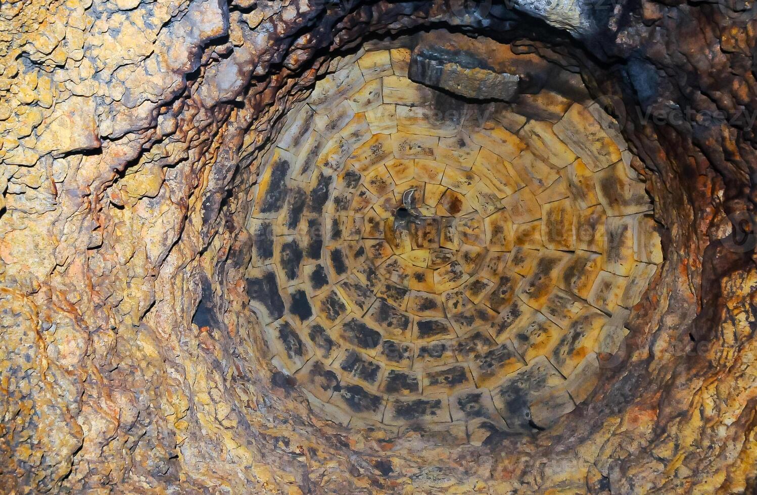 Walled domed vertical shaft in the old Odessa catacombs, cut out in the Pontian shell rock under the city photo