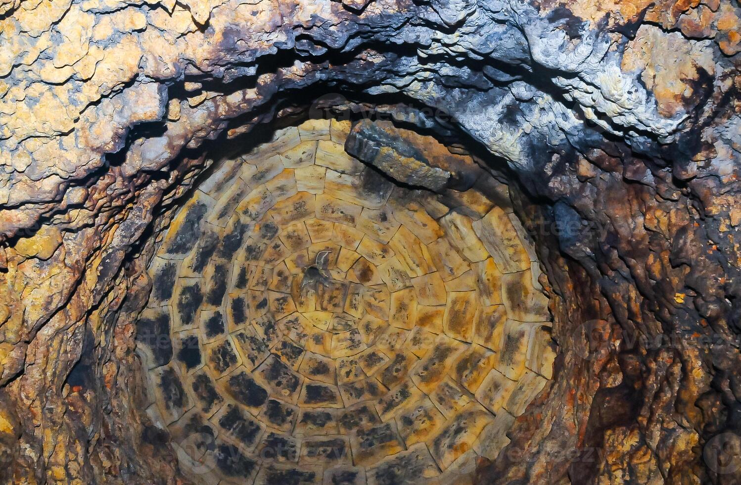 Walled domed vertical shaft in the old Odessa catacombs, cut out in the Pontian shell rock under the city photo