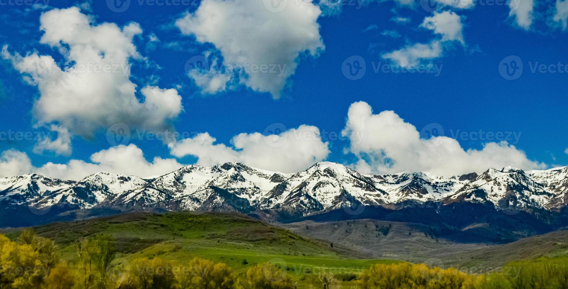 Rain clouds during the day over the plains in Utah, US photo
