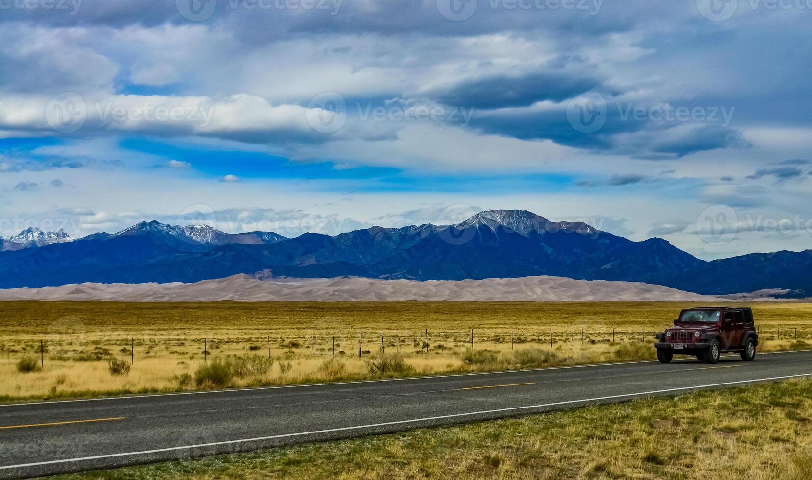 Great Sand Dunes with mountains in the background, Colorado, US photo