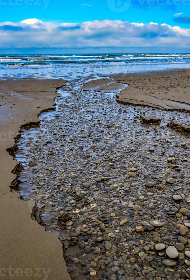 Multicolored round pebble stones on the Pacific Ocean in Olympic National Park, Washington photo